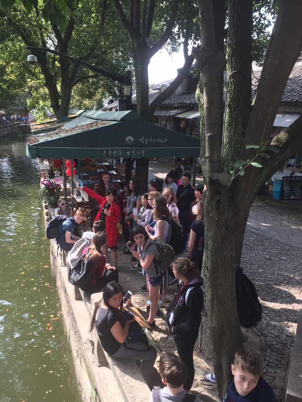 Students exploring a tree-lined canal in Tongli during a previous GSE China programme.